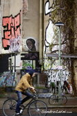 <b>BRL1003</b><br>Europe; Germany; Berlin; Graffiti; Street art; Street; Building; House; Neighborhood; Boy; Man; Bicycle; Cyclist; Straße