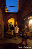 <b>MRC1037</b><br>Africa, African, Morocco, Moroccan, Arab, Arabic, Berber, Medina, Marrakech, People, Light, Lamp, Night, Shadow, Street, Woman, Walking, Walk, Sunset