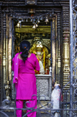 <b>NPL1013</b><br>Nepal; Kathmandu; Hinduism; Hindu; Temple; Street; Statue; Sculpture; Art; People; Woman; Praying; Devotee
