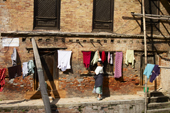 <b>NPL1078</b><br>Nepal; Kathmandu; Bhaktapur; Village; Street; People; Woman; Work; Laundry; Building; House