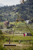 <b>NPL1124</b><br>Nepal; Kathmandu Valley; Panauti; Village; Countryside; Kids; Play; Game; Swing; Building; House; Landscape; People