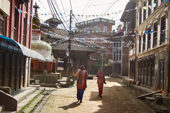 <b>NPL1128</b><br>Nepal; Kathmandu Valley; Panauti; Village; Building; House; Street; People; Woman; Walk; Stupa