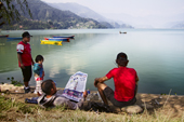 <b>NPL1181</b><br>Nepal; Pokhara; Lake; Phewa; People; Relax; Rest; Kid; Read; Boat; Nature; Fisherman; Fishing; Newspaper